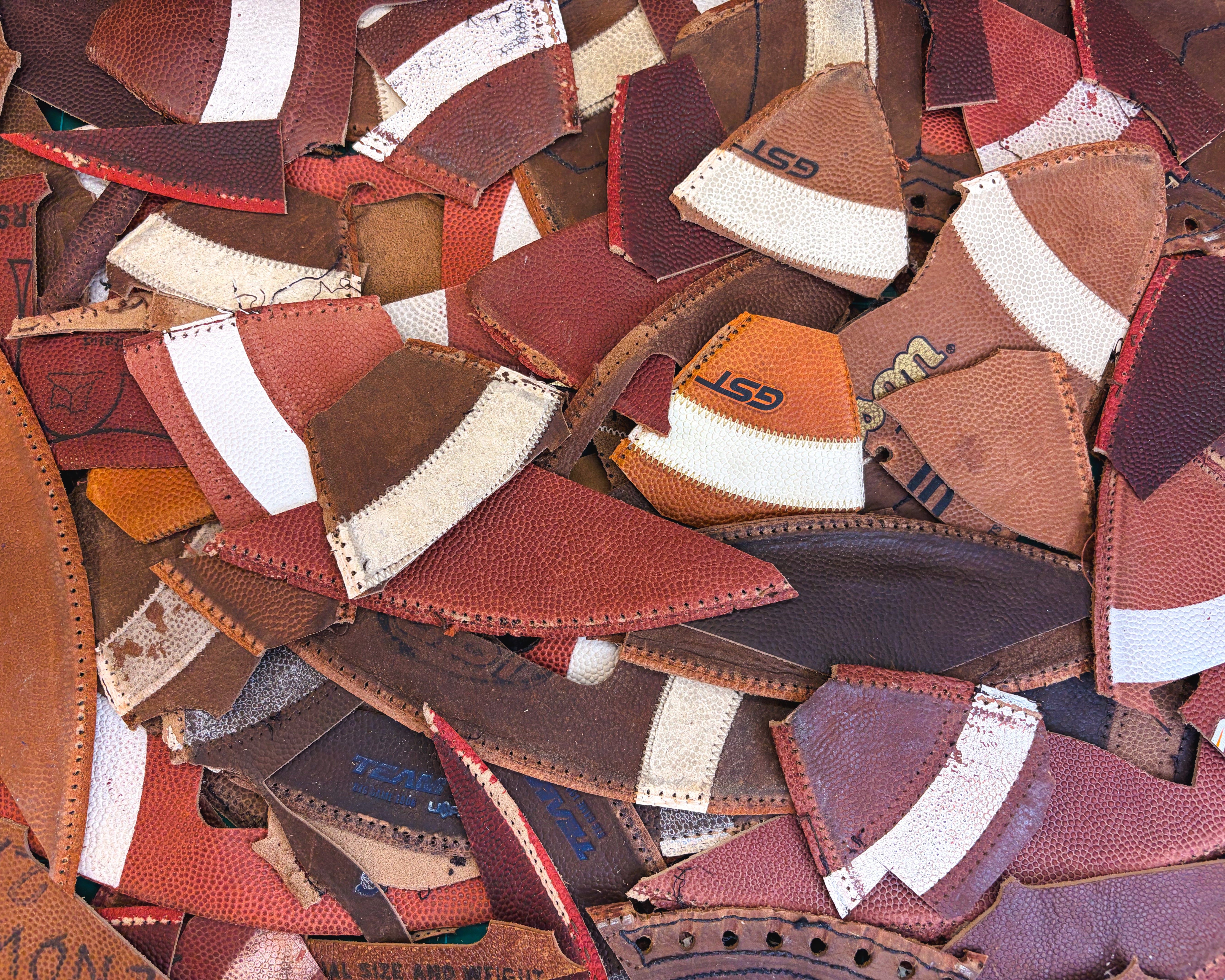 NCAA & NFHS Game-Used Football Scraps - 1 lb Variety Box